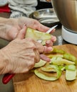 Chef cuts apples to make an apple pie. Step by step recipe Royalty Free Stock Photo
