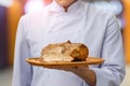 Chef cuts the meat is cooked . Royalty Free Stock Photo