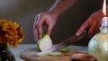The chef cuts a pear