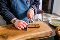 Chef cuts roasted bread. Master class in the kitchen. The process of cooking. Step by step. Tutorial. Close-up