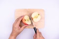 Chef cutting apple before cooking concept on a cutting board  on a white background, Sweet and juicy fruit Royalty Free Stock Photo