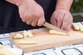 Chef is cutting baby corn