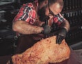 Chef cutting beef carcass in a restaurant Royalty Free Stock Photo