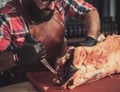 Chef cutting beef carcass in a restaurant Royalty Free Stock Photo