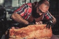 Chef cutting beef carcass in a restaurant Royalty Free Stock Photo