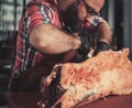 Chef cutting beef carcass in a restaurant Royalty Free Stock Photo