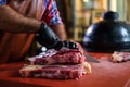 Chef cutting beef steakes in a restaurant Royalty Free Stock Photo
