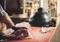 Chef cutting beef steakes in a restaurant Royalty Free Stock Photo