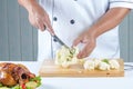 Chef cutting cauliflower Royalty Free Stock Photo