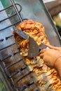 Chef cutting with doner knife Traditional Turkish Doner Kebab meat