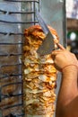 Chef cutting with doner knife Traditional Turkish Doner Kebab meat