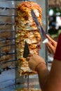 Chef cutting with doner knife Traditional Turkish Doner Kebab meat Royalty Free Stock Photo