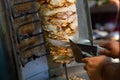 Chef cutting with doner knife Traditional Turkish Doner Kebab meat Royalty Free Stock Photo