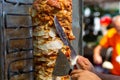 Chef cutting with doner knife Traditional Turkish Doner Kebab meat Royalty Free Stock Photo