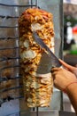 Chef cutting with doner knife Traditional Turkish Doner Kebab meat Royalty Free Stock Photo