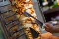 Chef cutting with doner knife Traditional Turkish Doner Kebab meat Royalty Free Stock Photo