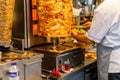 Chef cutting with doner knife Traditional Turkish Doner Kebab meat. Shawarma or gyros. Turkish, greek or middle eastern arab style Royalty Free Stock Photo