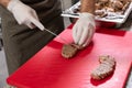 The chef is cutting the duck skin from the Beijing duck with a very sharp knife in a famous Chinese restaurant at the Chinese new Royalty Free Stock Photo
