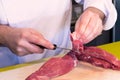 Chef cutting meat Royalty Free Stock Photo