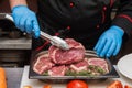 Chef cutting meat Royalty Free Stock Photo