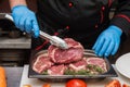 Chef cutting meat Royalty Free Stock Photo
