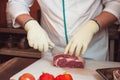 Chef cutting meat Royalty Free Stock Photo