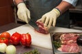 Chef cutting meat Royalty Free Stock Photo