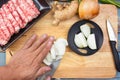 Chef cutting onion before cooking Royalty Free Stock Photo