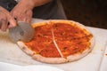 Chef cutting pizza Royalty Free Stock Photo