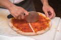 Chef cutting pizza Royalty Free Stock Photo