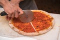 Chef cutting pizza Royalty Free Stock Photo