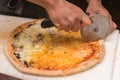 Chef cutting pizza Royalty Free Stock Photo