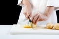 Chef cutting potatoes