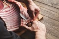 Chef cutting rack of lamb on wooden board i Royalty Free Stock Photo