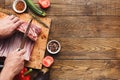 Chef cutting rack of lamb on wooden board Royalty Free Stock Photo