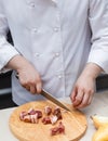 Chef Cutting Raw Meat on The Wood Block Royalty Free Stock Photo