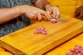 Chef Cutting Raw Meat on The Wood Block. Royalty Free Stock Photo