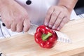 Chef cutting red bell pepper Royalty Free Stock Photo