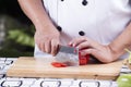 Chef cutting red bell pepper Royalty Free Stock Photo