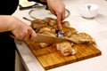 The chef is cutting the turkey fillet. Royalty Free Stock Photo