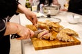 The chef is cutting the turkey fillet. Royalty Free Stock Photo