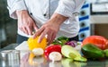 Chef cutting vegetables in his restaurant kitchen Royalty Free Stock Photo