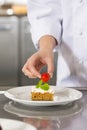 Chef decorate dessert cake with strawberry Royalty Free Stock Photo