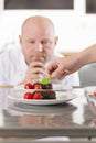 Chef decorate dessert cake with strawberry Royalty Free Stock Photo