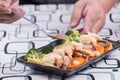 Chef decorated stir fry vegetables on plate