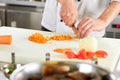 Chef dicing carrot. Royalty Free Stock Photo