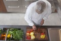 Chef Dicing Red And Yellow Bell Peppers