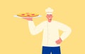Chef with dish. Smiling cook with prepared pepperoni pizza, white uniform. Royalty Free Stock Photo