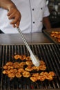 Chef doing live barbecue grill with prawns skewer Royalty Free Stock Photo