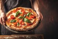 Chef duo presents Offering delectable pizza in a hotel or restaurant Royalty Free Stock Photo